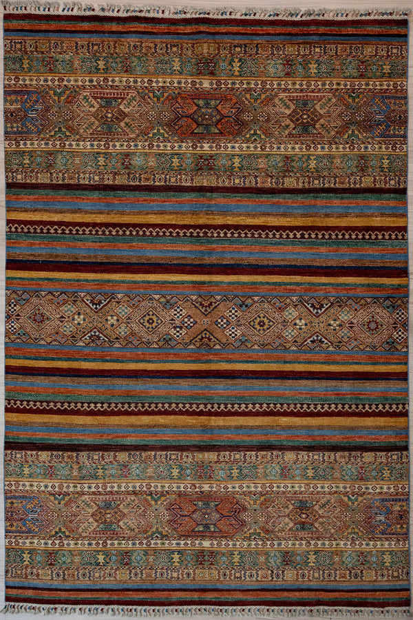 Authentic hand woven Multicolour Afghan Khurjin Chobi Wool Rug 284cm x 199cm, woven in Northern Afghanistan
Beauitiful tribal saddle bag influenced design all over, suitable for both traditional and contemporary interiors
Ariana multicoloured tassels for authenticity
Intricately hand woven with tight knots and perfect finishings, this unique Khurjin design is a one of a kind piece