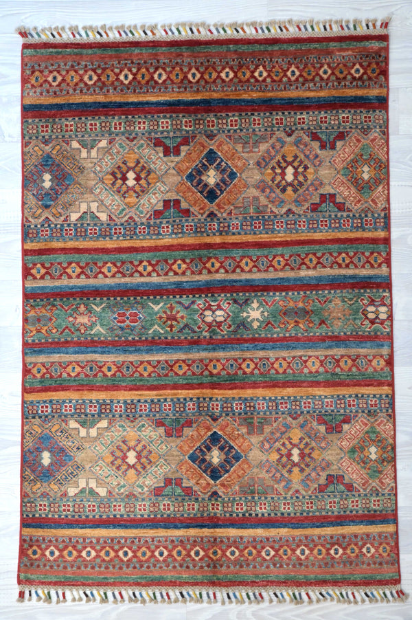 Make a bright little space with this  Handknotted Multicolour Afghan Khurjin Rug 148cm x 100cm. Pure soft mountain sheep's wool and harmonious lones of light red, orange ,pink and blue 