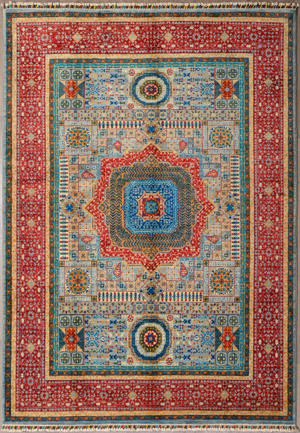 Authentic Hand woven Multicolour Mamluk Chobi Wool Rug 246cm x 175cm
Inspired by the ancient Mamluk design which consists of a Geometric patterns all over
Beautiful combination of blue centre & red border tones all made from local veg dyes