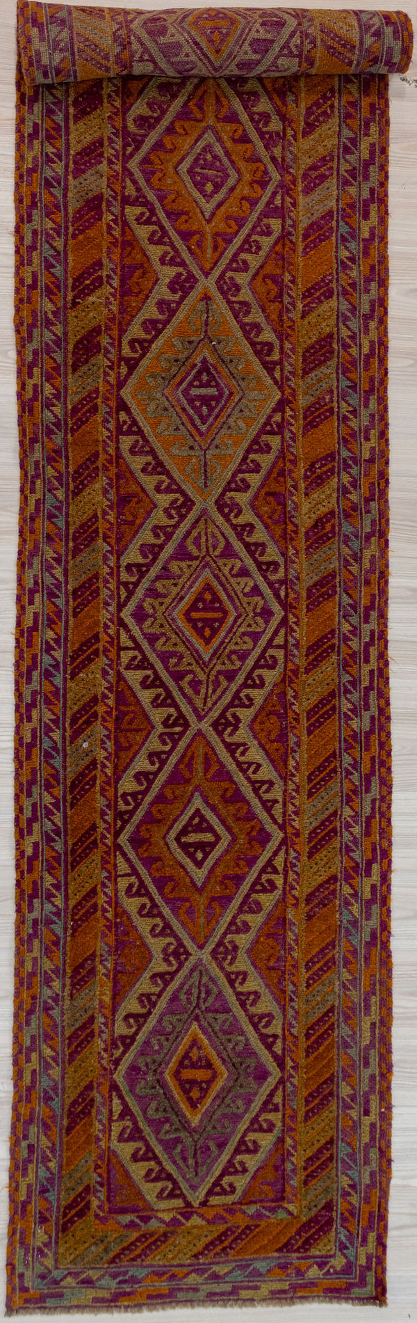Authentic Hand knotted Multicolour Persian Meshwani Wool Runner 380cm x 81cm woven in Central Asia
Not your average Meshwani. Made with finer detail and new colours of orange, olive green and fawn. Made with high quality hand dyed wool.
Combination of flatweave and woollen pile in a tribal design make these Meshwani rug designs unique. Although new, they have that feel of antiquity and boho vibe

Durable and Wear Resistant Suitable for High Traffic Areas