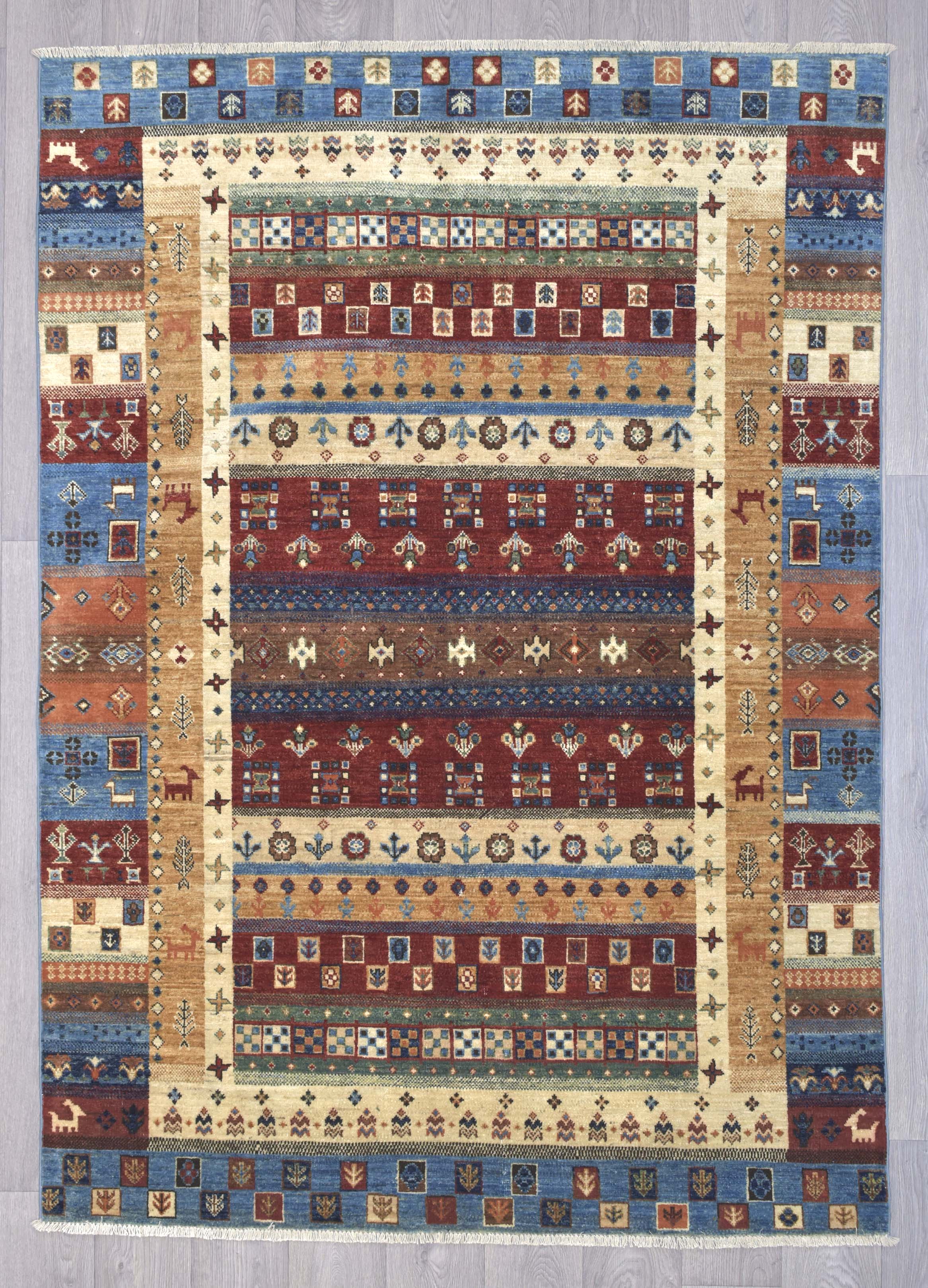 Authentic hand woven &nbsp; Multicolour Pictorial Afghan Khurjin Chobi 239cm x 173cm woven in Northern Afghanistan
Beautiful tribal khurjin design all over, suitable for both traditional and contemporary interiors. Feature figures animals plants and geometric motifs. relax and get lost in the details of this masterpiece
Intricately hand woven with tight knots and perfect finishings, this unique Khurjin design in such a large rug is truly a one of a kind piece
Suitable for a living room or in a bedroom