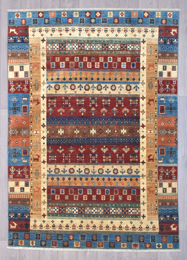 Authentic hand woven &nbsp; Multicolour Pictorial Afghan Khurjin Chobi 239cm x 173cm woven in Northern Afghanistan
Beautiful tribal khurjin design all over, suitable for both traditional and contemporary interiors. Feature figures animals plants and geometric motifs. relax and get lost in the details of this masterpiece
Intricately hand woven with tight knots and perfect finishings, this unique Khurjin design in such a large rug is truly a one of a kind piece
Suitable for a living room or in a bedroom