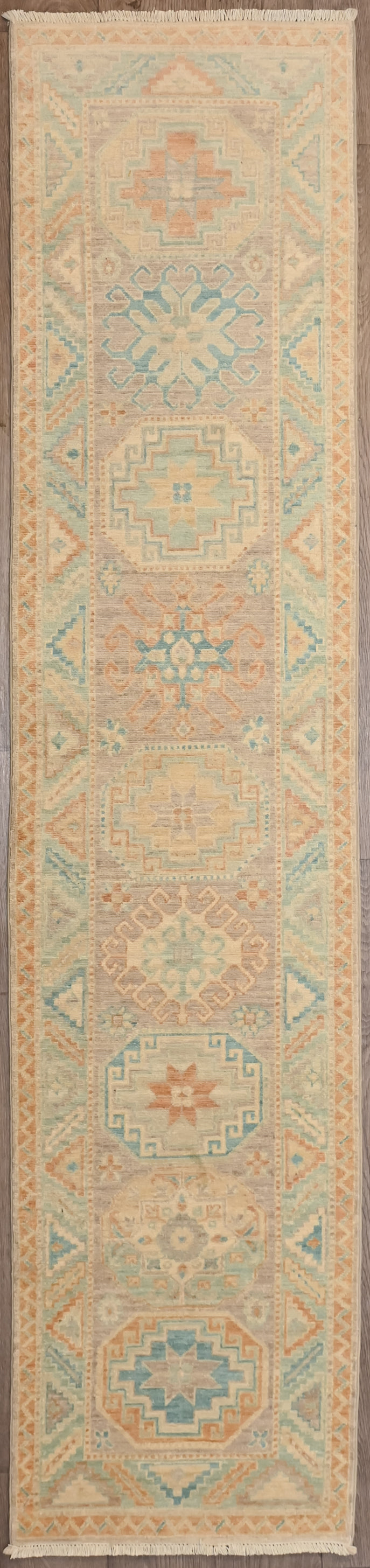hentic Hand woven Muted Afghan Chobi Wool Runner 282cm x 62cm

Enjoy this lovely runner in a fashionable lighter shade of pale. Traditional intricate botanical motifs adapted in a modern colour way.
Colour tones all made from locally sourced vegetable dyes

Having a light and dark aspect is a trademark of Handmade Rugs
