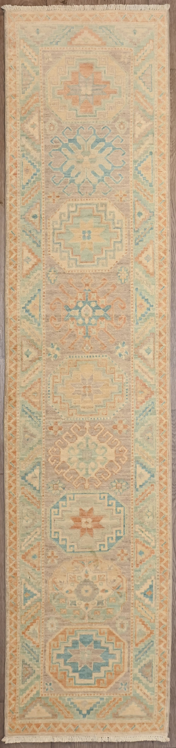 hentic Hand woven Muted Afghan Chobi Wool Runner 282cm x 62cm

Enjoy this lovely runner in a fashionable lighter shade of pale. Traditional intricate botanical motifs adapted in a modern colour way.
Colour tones all made from locally sourced vegetable dyes

Having a light and dark aspect is a trademark of Handmade Rugs