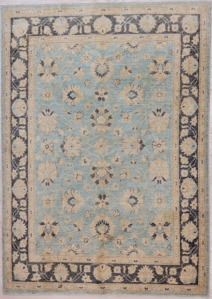 Authentic Handknotted Muted Blue Afghan Chobi Wool Rug 207cm x 153cm.
Beautiful muted tones all made from natural vegetable dyes. Washed out Indigo fawns and creams all held within a soft darker indigo floral border
Unique contemporary traditional design adaption suitable to brighten your interior.