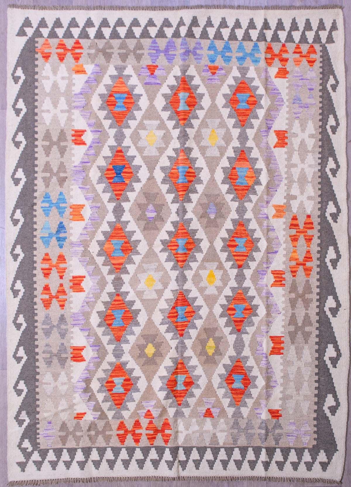 Handknotted Multicolour Boho Kilim 240cm x 175cm
Lovely soft contemporary colours.
These traditioal flexible wool rugs have many uses in the modern Boho home&nbsp; Rare muted field tones all over