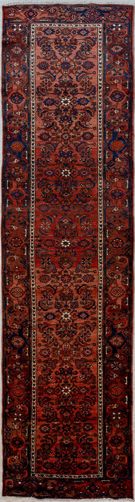 Guaranteed Original Muted Red Vintage Persian Hamadan Wool Runner 395cm x 96cm woven in Central Asia.
This beauty is all in tones of muted red. Lovely dark pink that is nearly red through a range of muted red tones. Stylised chrysanthemums and other blossums are typical of Hamedan style. Bright pink and cream are used in highlights.
Having a light and darker aspect side is a trademark of Handmade Rugs