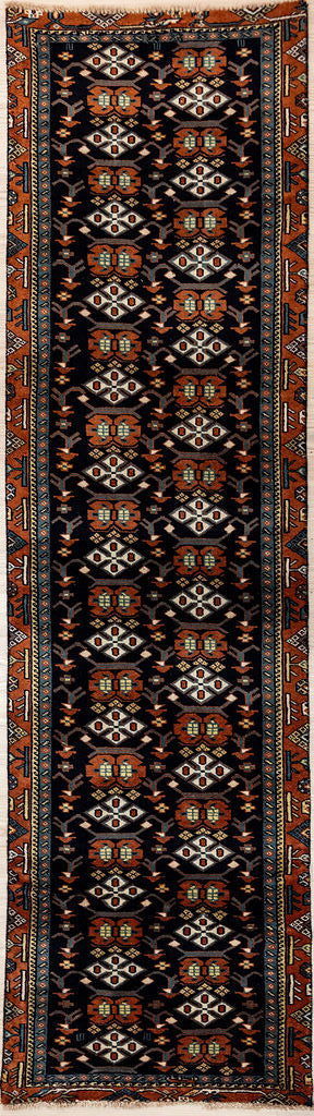 Persian Herati Wool Runner 211cm x 58cm Wool Runner.
Finely hand knotted with intricate weave and soft wool
Beautiful geometric alternating offset design with cream and other natural dyed accents on rust and navy base.
Everything in this design was the choice of the weaver working from tradition and memory. Narrow vintage sizing good for narrow halls