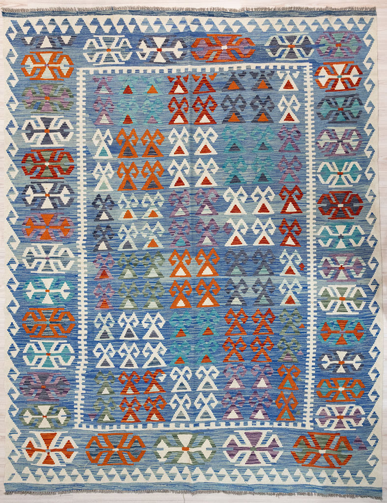 Authentic Handknotted Rare Blue Afghan Boho Wool Kilim 294cm x 242cm Rare combination of indigo colours along with fresh light blues cream and white. Kilims are a flatweave rug used for over a millennium in Tribal areas of Central Asia Anatolia. Historically used by nomads as floor covering, tent covering, transported&nbsp; on horseback because of its lightweight nature
Perfect for a summer rug, coastal or to bring more character &amp; life into your interior