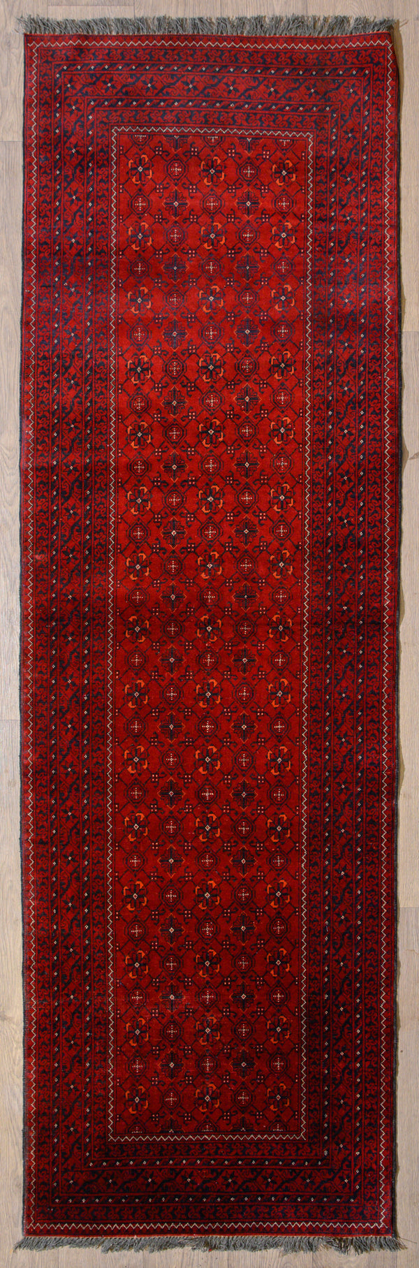 uthentic Handknotted Red Afghan Kundus Bashiri Runner 280cm x 80cm woven in Kundus, Northern Afghanistan
Red colour tones made from natural veg dyes including Pomegranates&nbsp;
Unique Bashiri design all over symbolises the artistry of the Kundus region
Having a light and dark side is a trademark of Handmade Rugs
Durable and Wear Resistant Suitable for High Traffic Areas