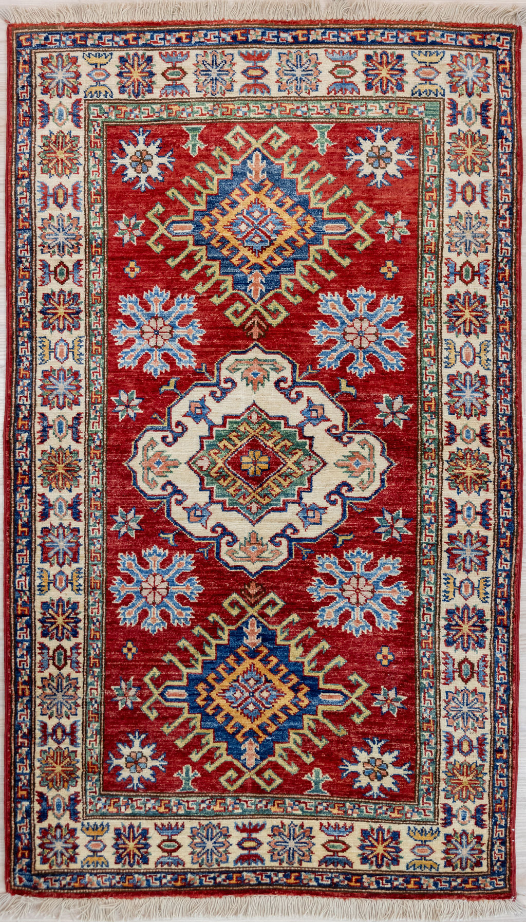 Red Afghan Super Kazak Wool Rug 167cm x 94cm Guaranteed Original Handknotted Rug woven in Central Asia with soft lustrous Local and NZ wool 124cm x 181cm
Having a light and dark side is a trademark of Handmade Rugs
Durable and Wear Resistant Suitable for High Traffic Areas
Colors in This Piece Originate from Natural Vegetable Dyes