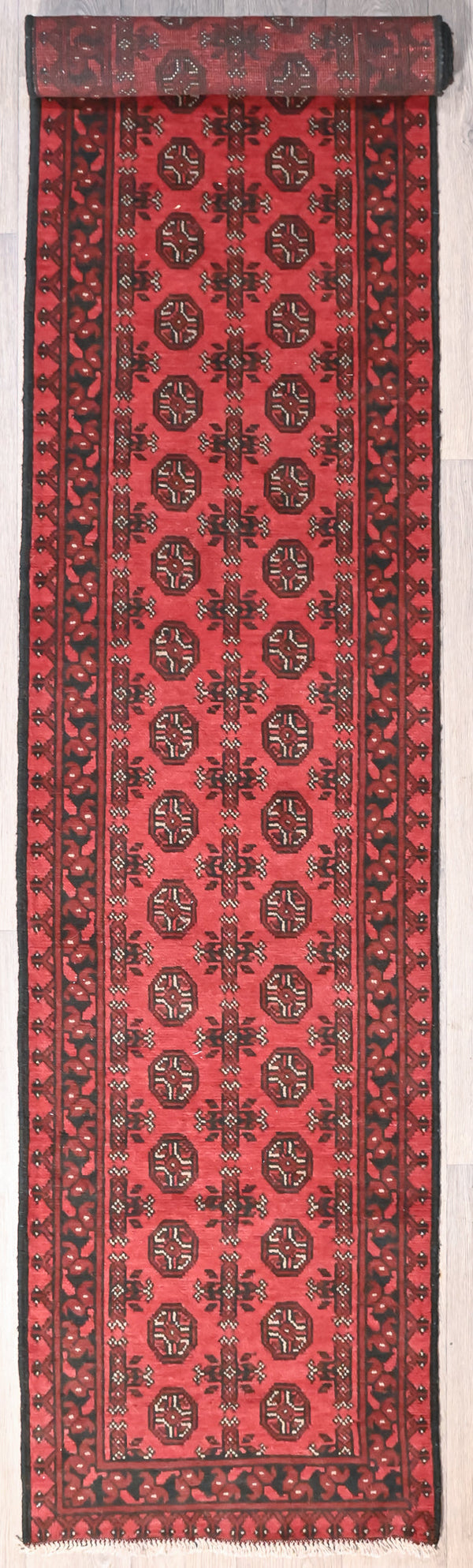 Red Afghan Turkoman Bokhara Wool Runner 400cm x 80cm an intricate fine border contains repeating geometric Gul designs