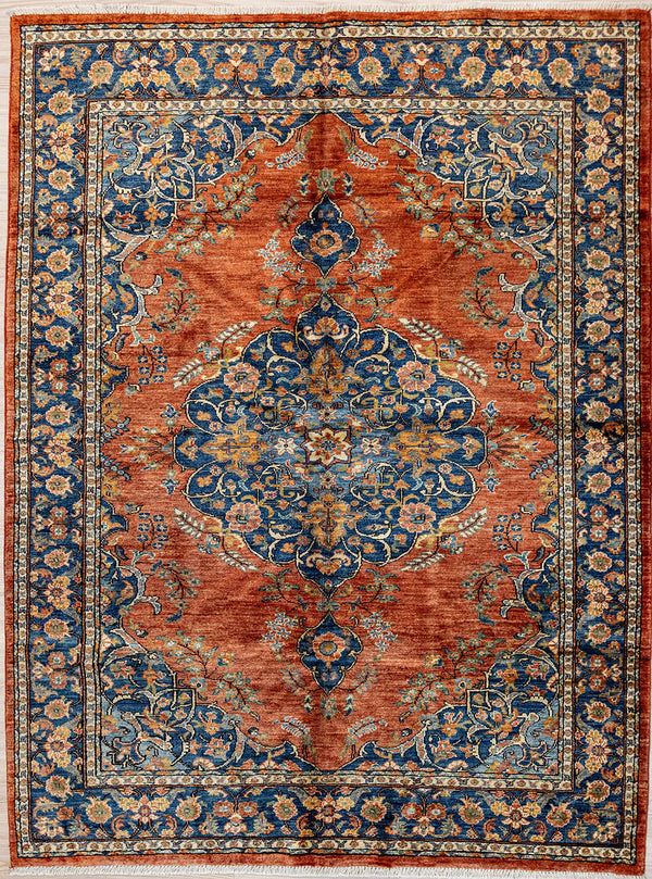 Authentic Hand Knotted Red Orange Afghan Chobi Wool Rug 203cm x 146cm woven in Central Asia
A unique adaption of traditional floral Tabriz rug design bringing a touch of modern contemporary to your home.
Lovely colour palette of soft Orange toned Red&nbsp; field along with Indogo blue muted floral medallions and a mix of other natural dyed colours pink, mustard, burgundy all set in a wide blue botanical border