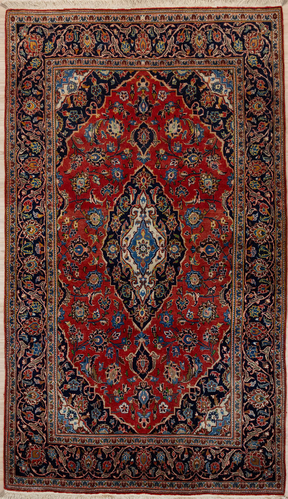 Authentic Handknotted Red Persian Kashan Wool Rug 240m x 140cm&nbsp;
Red field tone combined with a mix of blue &amp; navy medallion
Woven by the artisans of Kashan
In superb condition
Perfect to bring character and colour to any interior.
Great for high traffic areas