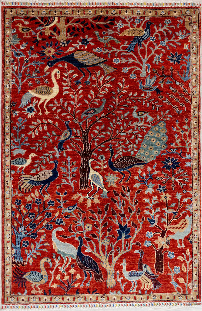 Authentic Hand woven Red Pictorial Afghan Chobi Wool Rug 184cm x 126cm made by local master craftswomen and their families in AfghanistanRug making starts outside with the shepherding of sheep and hand spinning of wool while watching over them. Bring the outside inside with this design showcasing the flora and fauna of the Central Asia region.
Colour tones all made from locally sourced vegetable dyes including indigo, madder root for red. The dyers have many secret recipes passed down over centuries.