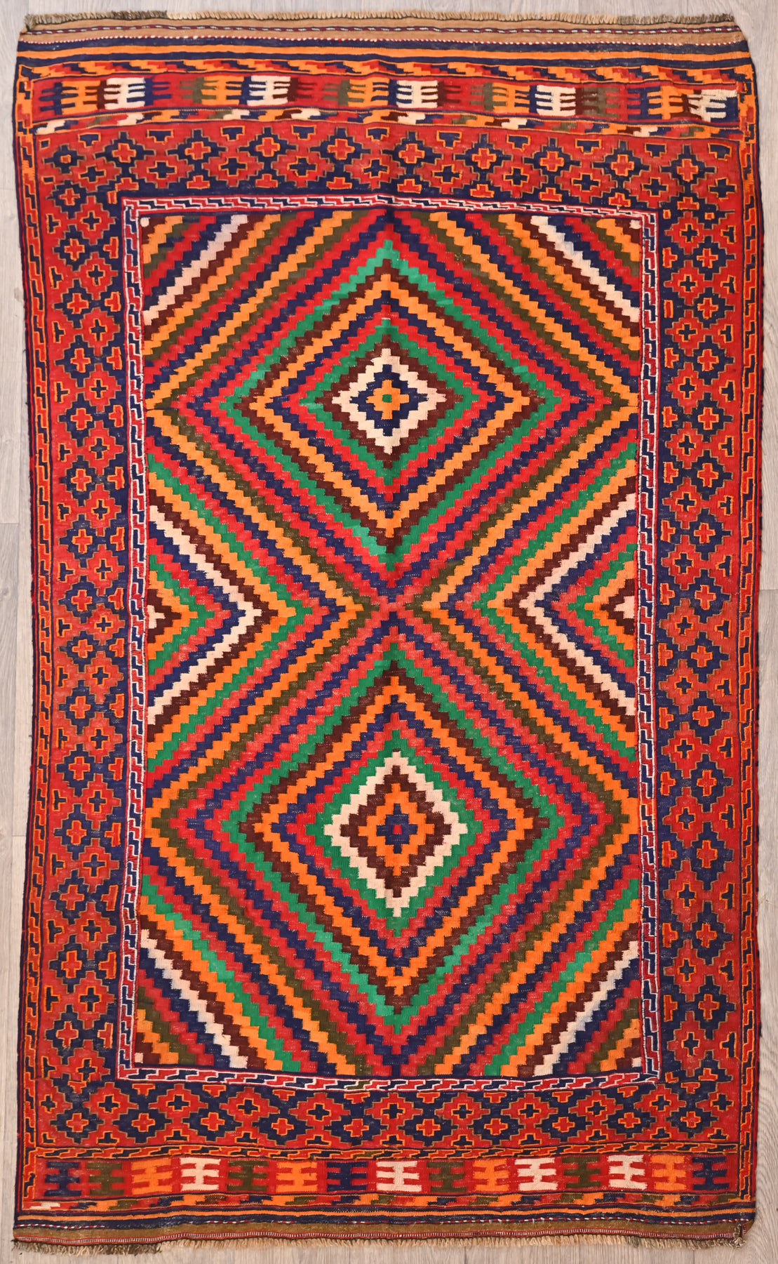 Authentic Handknotted Red Vintage Persian Wool Kilim 220cm x 132cm, Strong colours made with natural dyes such as madder root. Suits Boho, modern or MCM interiors. Affordable and eye catching.

Durable and Wear Resistant Suitable for High Traffic Areas
It Has Taken Approximately 2-3 Months of Weaving to Complete This Piece