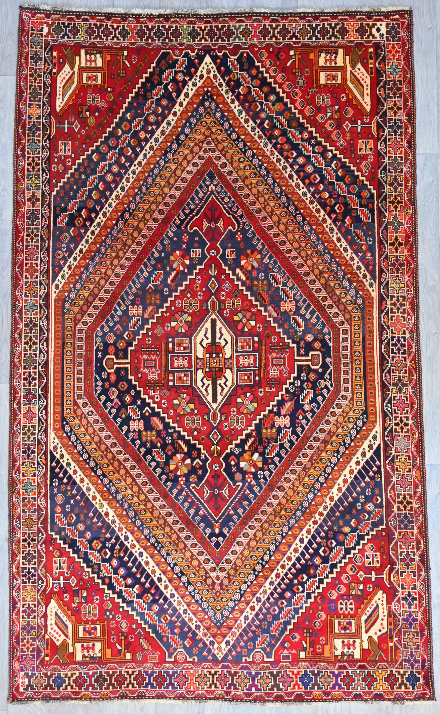 Authentic Hand knotted Red and Navy Persian Tribal Shiraz Wool Rug 292cm x 173cm
Having a light and darker aspect is a trademark of Handmade Rugs
Durable and Wear Resistant Suitable for High Traffic Areas