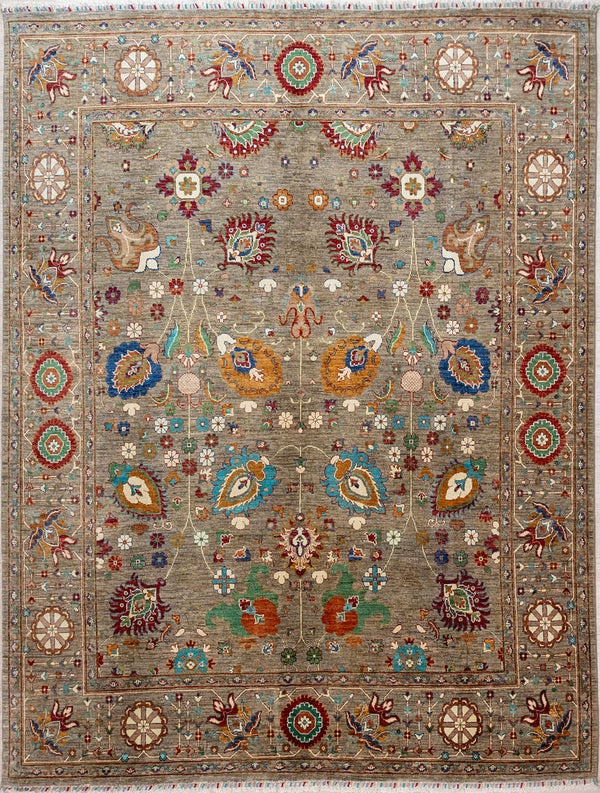 Hand knotted Taupe Afghan Sultani Chobi Wool Rug 298cm x 252cm.
Design features curvilinear stems with budding and flowering lilies, iris , daisies and crocus. A formal border featuring blooming lotus and the wheel of karma completes this one of-a-kind masterpiece
Lovely natural dyes with make for a array of rustic multicolour tones on a warm grey background which is the colour of undyed natural sheep's wool.