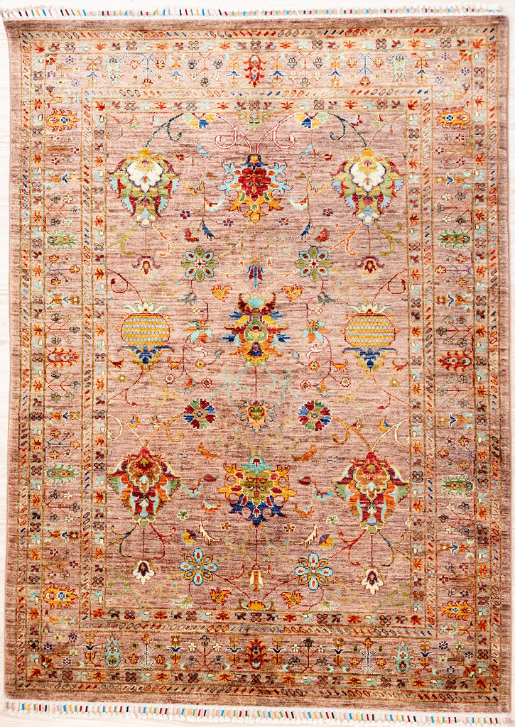 Authentic Hand Knotted Tea Rose Afghan Sultani Chobi Wool Rug 205cm x 151cm woven in Shebarghan, Northern Afghanistan
A new and different colour combination of a marled tea rose pink field with multicolour baroque floral motifs all over. This technique of hand dying and spinning gives a soft antiqued look.&nbsp;
Beautifully decorated with colourful, silk bound 'Ariana' tassels on each end
Colour tones all made from local vegetable/plant based dyes
This new rug is at home in both contemporary and traditional
