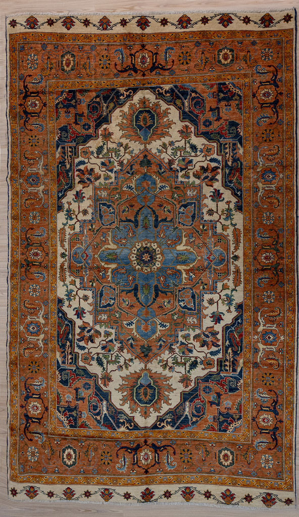 Authentic hand woven Terracotta Rust Afghan Chobi Wool Rug 322cm x 201cm woven in Shebarghan, Northern Afghanistan

Finely hand woven with perfect finishings, beautiful array of colours on. a terracotta and rust field. Unique design with centre field compressed by elaborate wide borders. Lovely blue medallion and special extra kiilim ends
Very suitable for living room or in a large bedroom

