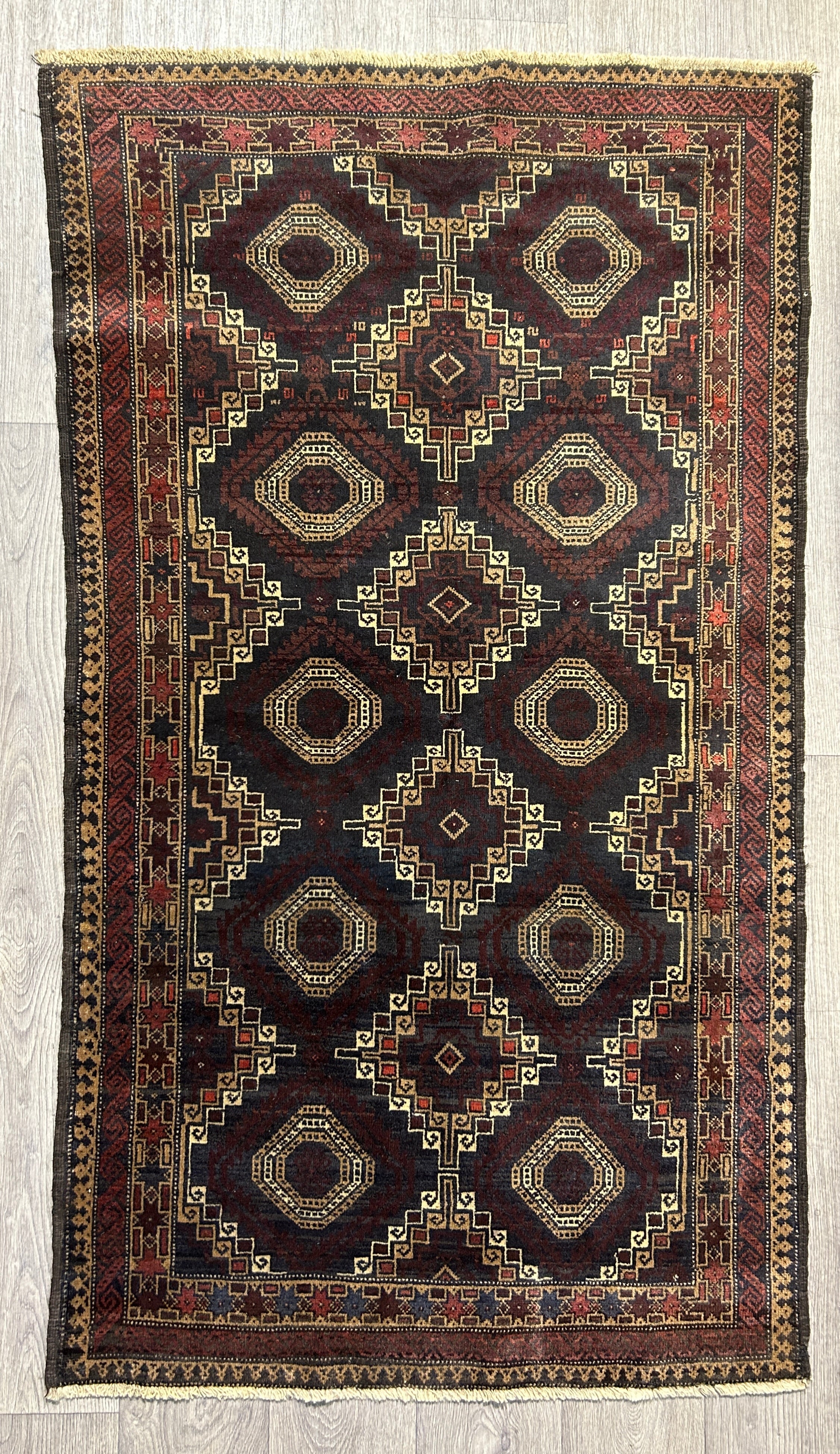 Authentic Handknotted Vintage Afghan Veg Dye Chobi Wool Rug Woven in the 1980's 140cm x 92cm
Having a light and dark side is a trademark of Handmade Rugs,
Remarkable all over tessellated design of squares.
