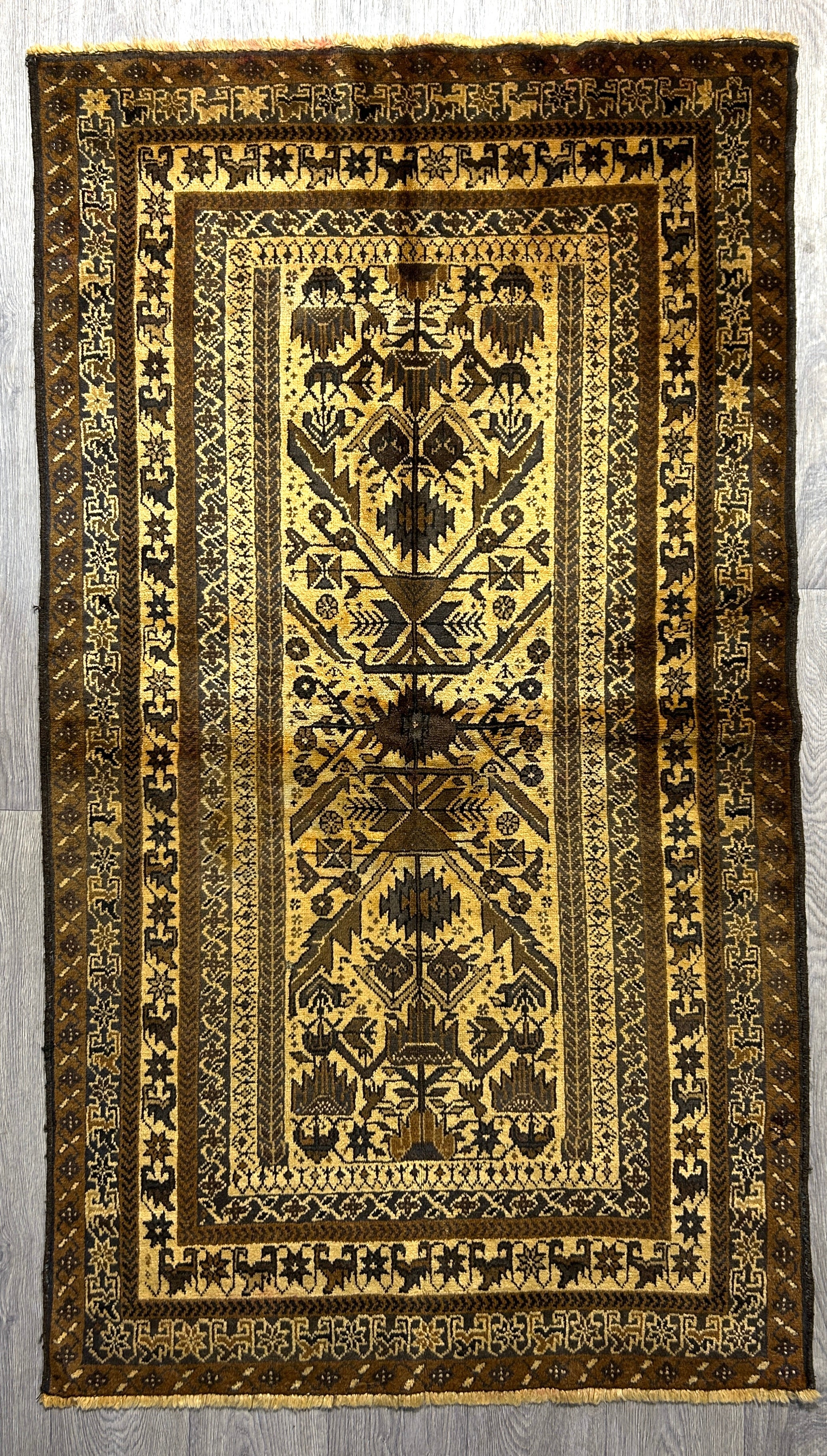Authentic Handknotted Vintage Persian Baluchi Wool Rug Woven in the 1980's 193cm x 110cm
Fascinating and intricate motifs on multiple borders makes this an engaging piece which your eye will want to return to again and again.
Earthy palette tones made with natural dyes and natural sheep wool colours.