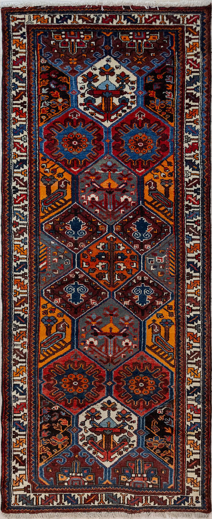 Guaranteed Original Vintage Persian Hamadan Wool Runner 287cm x 118cm woven in Central Asia.
An all over pattern of large hexagons occupies the centrei of this honey of a runner, and each hexagon contains its own little story. Orange and green are not common in Hamedan
Having a light and darker aspect side is a trademark of Handmade Rugs
Durable and Wear Resistant Suitable for High Traffic Areas