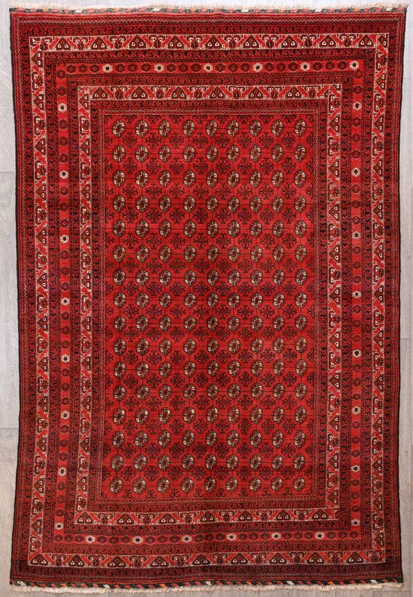 Authentic Handknotted Vintage Red Afghan Mori Gul Wool Rug 289cm x 187cm woven c. 1960's

Hand woven by traditional Turkoman artisans in Northern Afghanistan, kept in fine condition over the decades

Symmetrical design mori gul refers to the hexagon shaped motif which has been woven in Afghanistan for many centuries