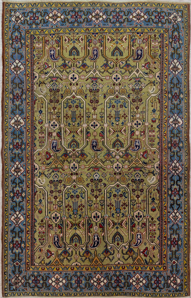 Bring a bold touch of Persian heritage into your home with our Vintage c.1970's Persian Qum Wool Rug 205cm x 135cm
Handknotted in the city of Qum, this rug has a classic arts and crafts revival  type pattern and is made of pure lambs wool for a soft, luxurious feel under your feet.
&nbsp;All colours are natural vegetable dyes giving soft greens, creams, browns and pale indigo all achieved&nbsp; with techniques passed down over generations&nbsp;

Durable and Wear Resistant, Affordable luxury.evival