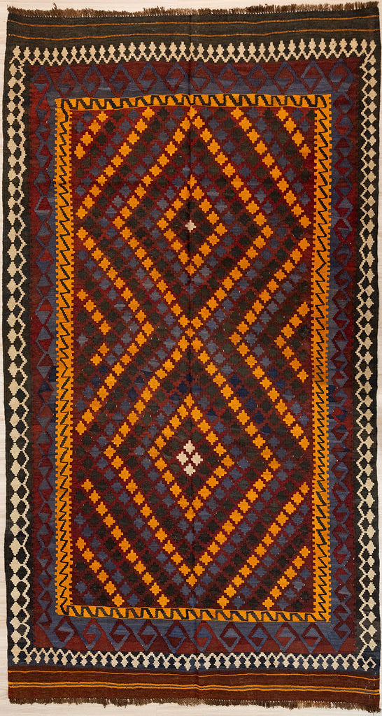 Authentic Handknotted Vintage c.1980's Persian Wool Kilim 272cm x 154 cm. In popular midcentury colours of reds browns and orange this rug is a good size for a galley kitchen or sunroom
The colour tones have aged gracefully over the decades and the wool softens