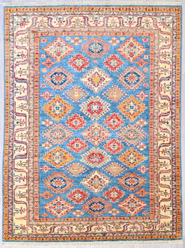 Authentic Handknotted Wool Blue Fine Afghan Super Kazak Rug woven in Central Asia
"Super" in super Kazak refers to the super fine knotting and the superior wool pile with its soft lustrous sheen.
Having a light and dark aspect is a trademark of Handmade Rugs
Durable and Wear Resistant Suitable for High Traffic Areas