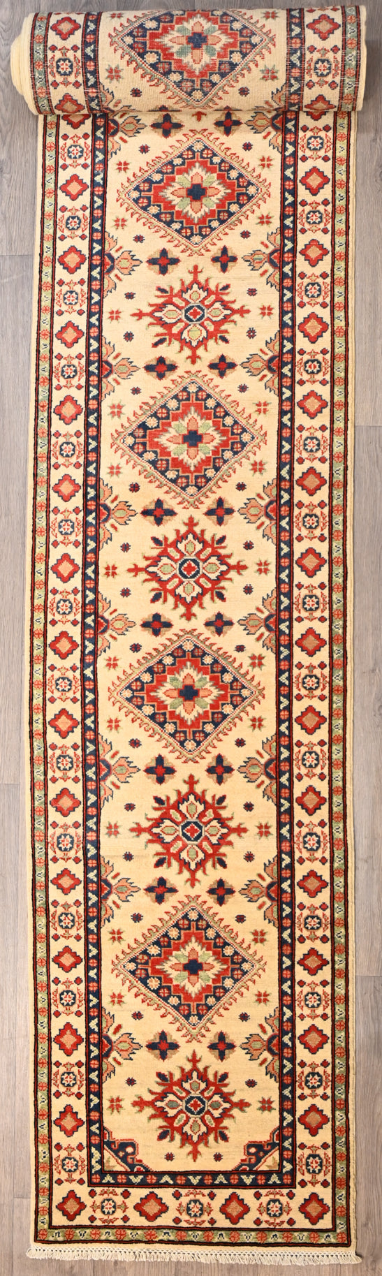 Authentic XXL Cream Afghan Kazak Wool Runner. Rare long size
Grest for modern traditional or MCM interiors
Having a light and dark side is a trademark of Handmade Rugs
Durable and Wear Resistant Suitable for High Traffic Areas
All Colours in This Piece Originate from Natural Vegetable Dyes