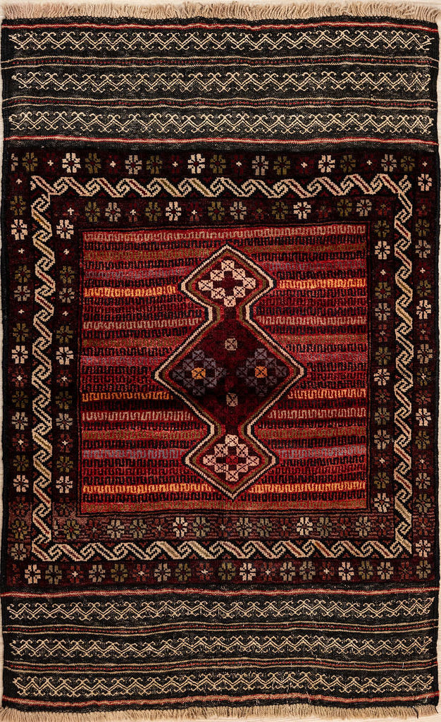 Authentic Hand knotted Persian Baluchi Wool Rug 130cm x 80cm
Woven by the Baluchi tribe of artisans
Beautiful unique rug design. A bold spindel motif sits atop a field that resembles digital code. An amazing twisted ribbon border encloses the central design. Elaborate woven kilim borders on each end complete the beautiful mystery. this kind of rug is always a one off piec. A snapshot in time