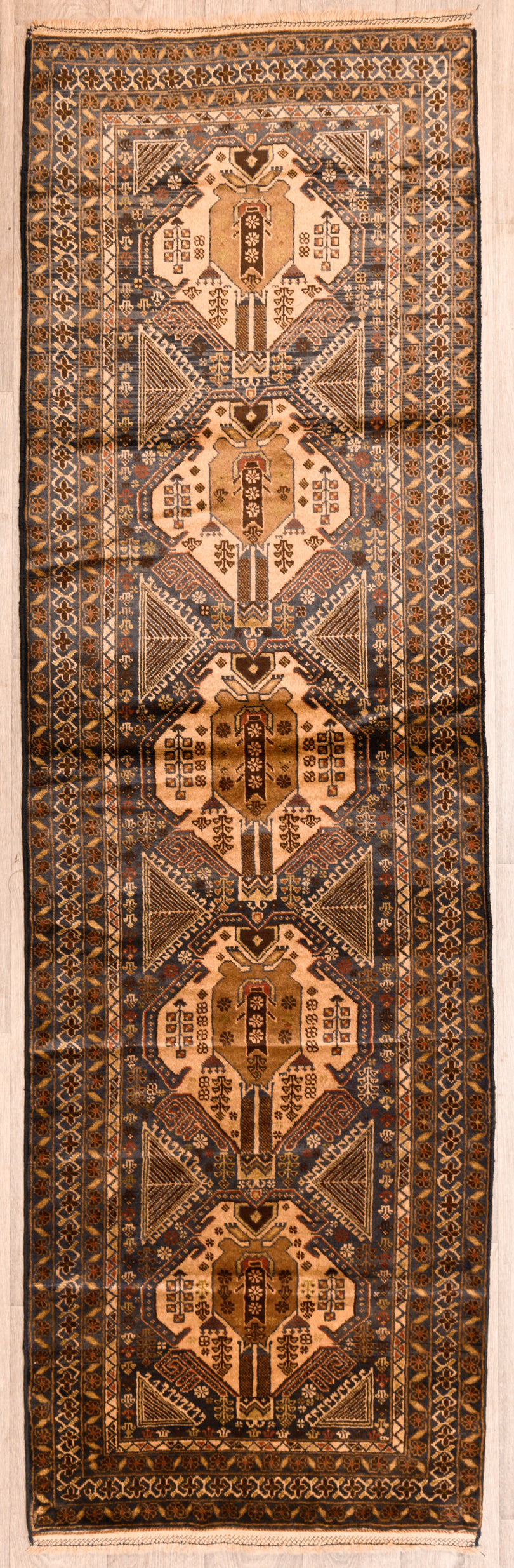 uthentic Handknotted Vintage Persian Baluchi Wool Runner 312cm x 96cm woven early 1970's
Aged gracefully and maintained in great condition
Having a light and darker aspect is a trademark of Handmade Rugs