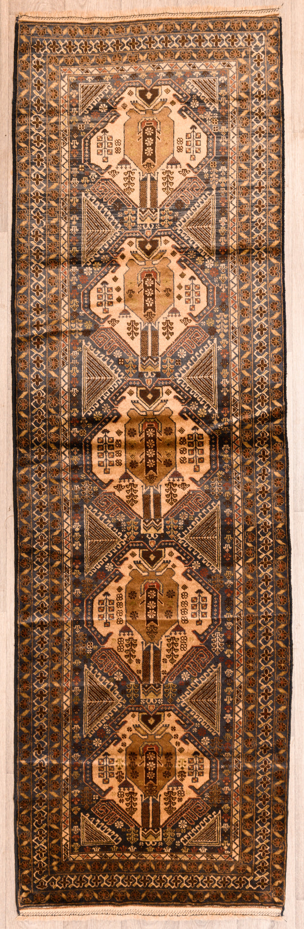 uthentic Handknotted Vintage Persian Baluchi Wool Runner 312cm x 96cm woven early 1970's
Aged gracefully and maintained in great condition
Having a light and darker aspect is a trademark of Handmade Rugs