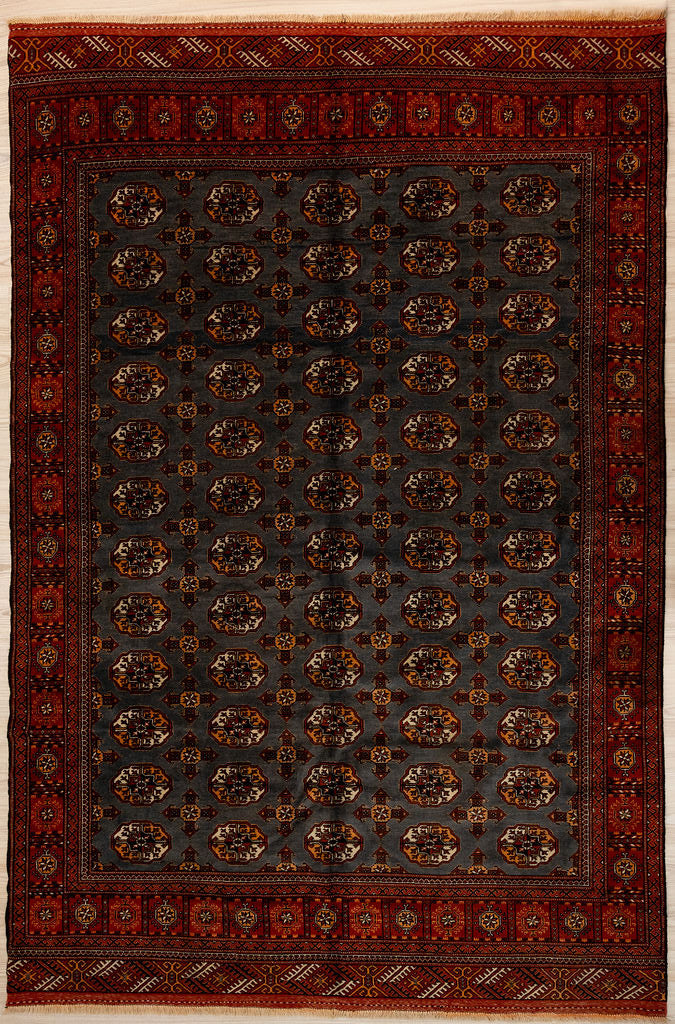 Authentic handknotted Vintage Afghan Bokhara Wool Rug 293cm x 200cm

The elegant repeating Bokhara motifs or Guls are slightly different in design in each unique rug and functioned like a weaver's signature.&nbsp;
This unusual vintage rug rug has a natural sheep coloured charcoal background.
Having a light and dark aspect is a trademark of Handmade Rugs
Durable and Wear Resistant Suitable for High Traffic Areas