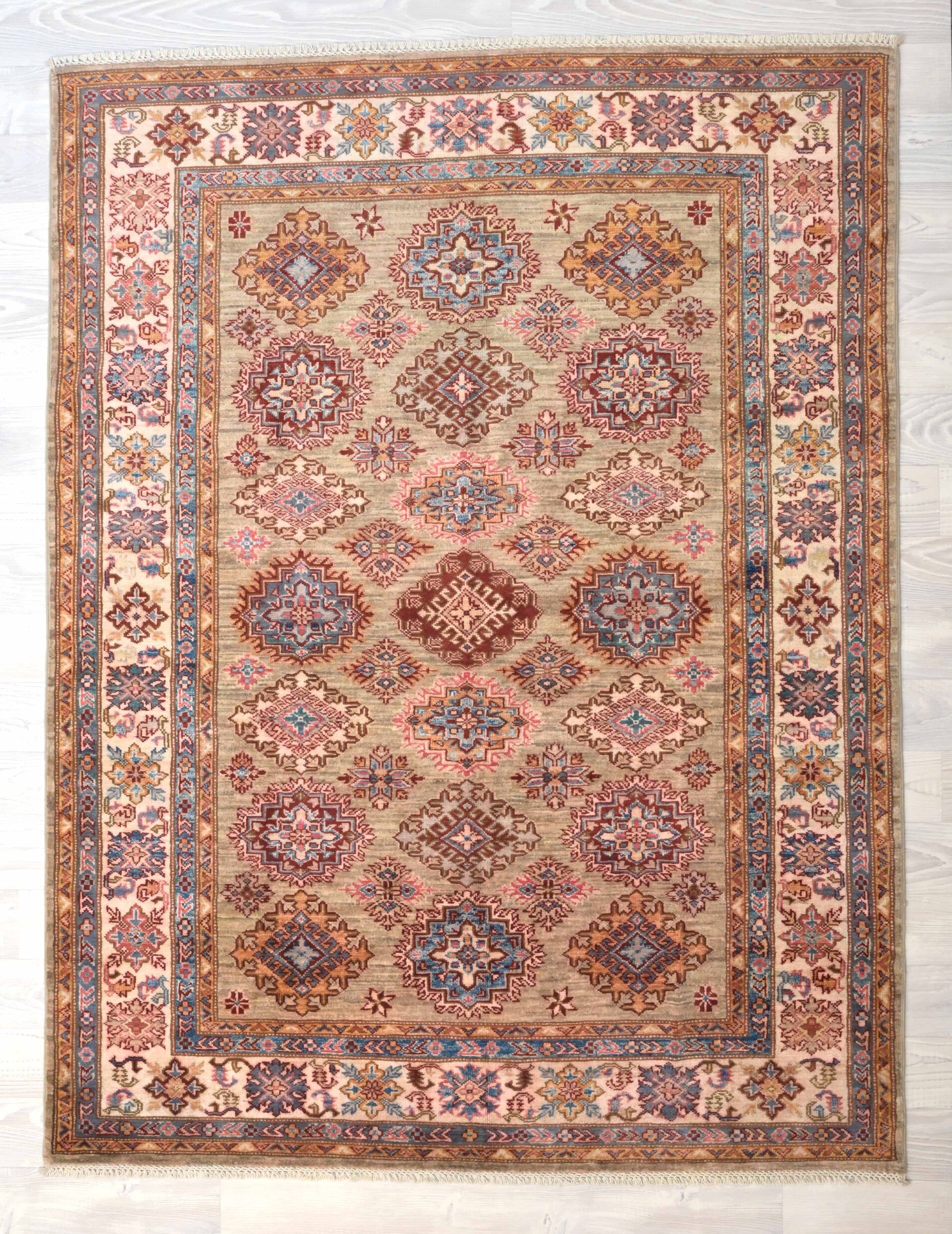 Guaranteed Original Hand Knotted Fine Afghan Kazak Rug
Durable and Wear Resistant Suitable for Low or High Traffic Areas
All Colors in This Piece Originate from Natural Vegetable Dyes.
Hand Spun Wool Pile on Cotton Base
Origin: Hand Woven in Northern Afghanistan