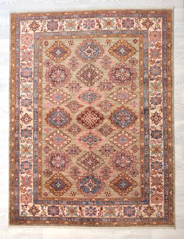 Guaranteed Original Hand Knotted Fine Afghan Kazak Rug
Durable and Wear Resistant Suitable for Low or High Traffic Areas
All Colors in This Piece Originate from Natural Vegetable Dyes.
Hand Spun Wool Pile on Cotton Base
Origin: Hand Woven in Northern Afghanistan